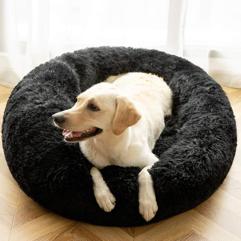 Calming donut cuddler pet bed in plush shag fur