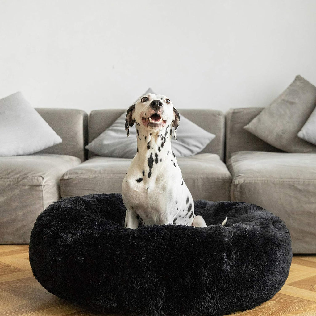 Calming donut cuddler pet bed in plush shag fur — close-up of texture and finish